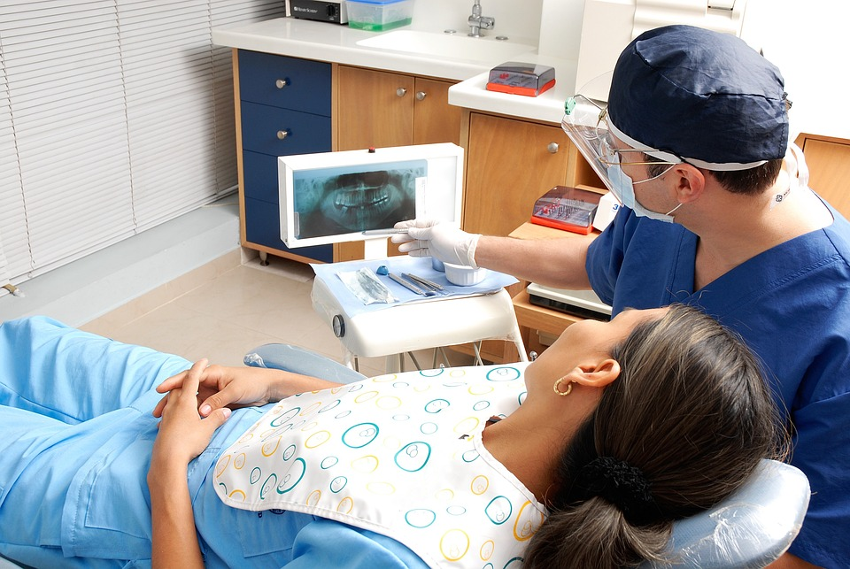dentist showing an Xray to a female patient 